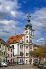 Fototapeta premium Historic Town Hall in Loket, Czech Republic. Baroque architecture building under blue sky with white clouds