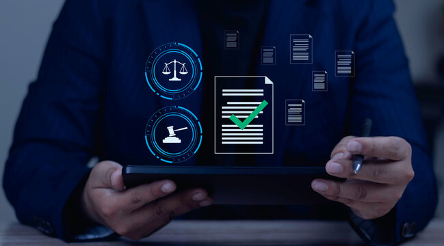 Businessman using tablet for legal and regulatory compliance. Digital hologram of corporate document verification and management system for business integrity.