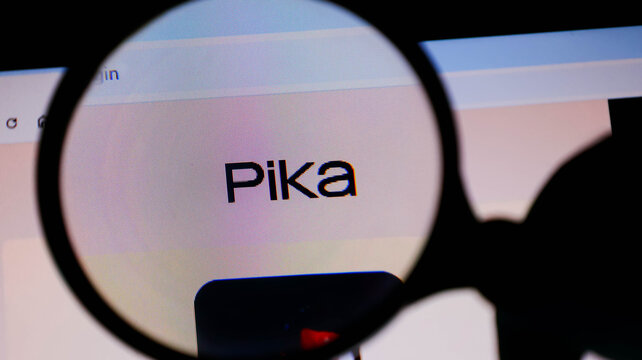 Magnifying glass focused on the pika logo on a digital screen