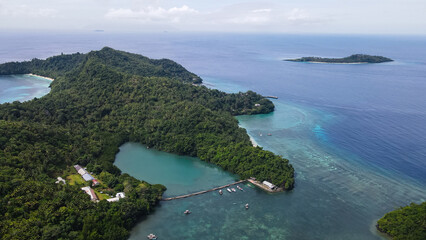 Fototapeta premium Aerial View of Coastal Village and Tropical Beach at Pulau Para 1, North Sulawesi, Indonesia