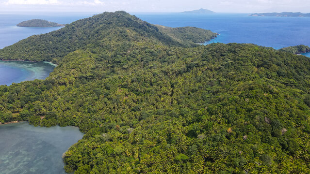 Aerial View of Coastal Village and Tropical Beach at Pulau Para 1, North Sulawesi, Indonesia