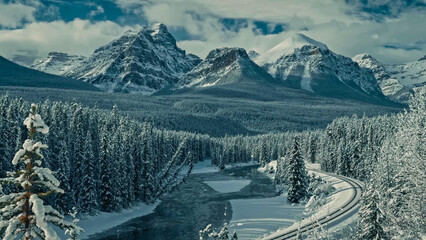 Bow River Valley Winter Panorama with Railway and Rocky Mountains, Banff National Park, Canada © Banu
