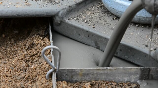 The process of continuously pouring liquid concrete mortar into a metal formwork at a construction site