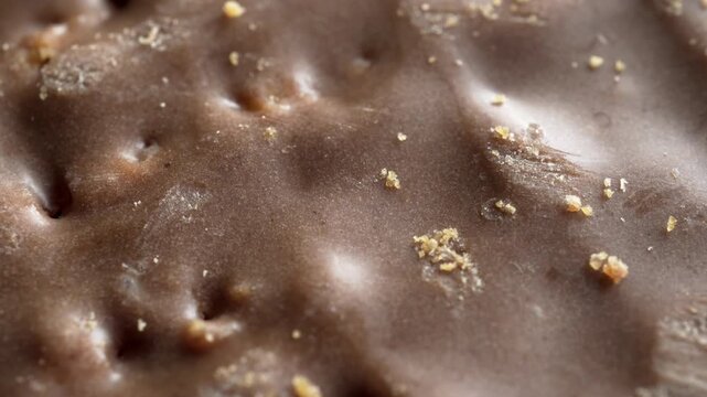 Chocolate covered cookie biscuit extreme close up stock footage