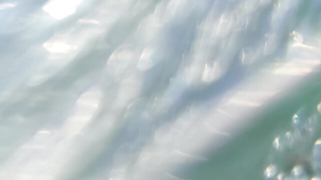 Immersive POV of Water Splashing and Submerging the Camera