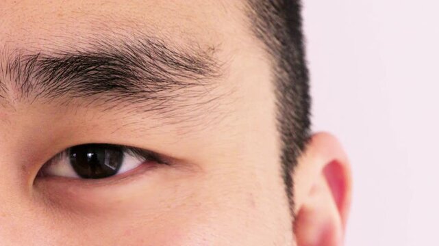 Closeup, face and eye with optometry, retina examination or glaucoma test in vision care. Optical health, portrait and person with blink, eyesight perception or wellness in ocular assessment.
