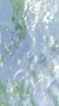 Immersive POV of Water Splashing and Submerging the Camera