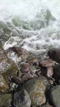 Refreshing Mountain Creek Water Hitting Rocks in Slow Motion Vertical