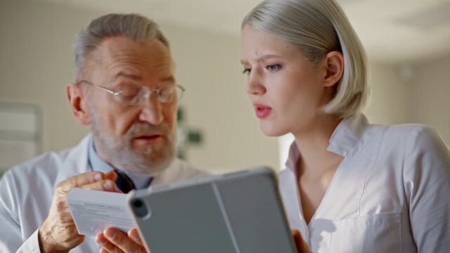 Hands holding tablet computer pharmacy closeup. Professionals discussing tablets