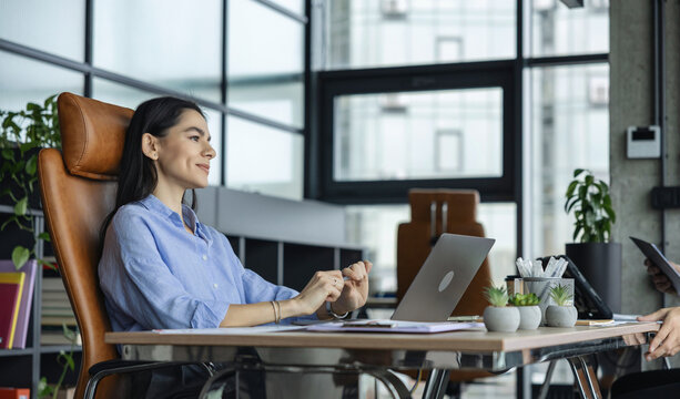 Business success. Businesswoman boss in business office. Woman office manager. Woman CEO or secretary assistant. Businesswoman boss with laptop in office. Thoughtful and inspired