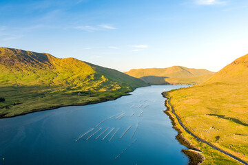 Obraz premium Aerial view of Killary Fjord near Leenane on the Galway Mayo border, Ireland. Irelands only fjord winds through the dramatic Connemara and Mayo mountain landscape.