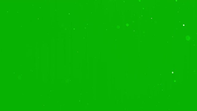 Beautiful slow motion snow dust with soft light particles on a green background. Perfect for Christmas visual, winter intro, cinematic overlay, motion design project. White snowflakes falling isolated
