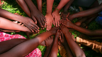 uniting hands from different races, cultures and continents © angel