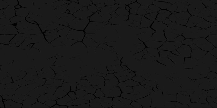 Dark cracked earth or mud background texture with dry soil and ground pattern