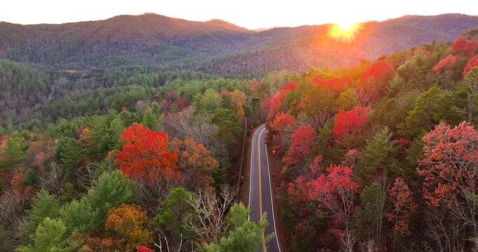 Blue Ridge Parkway in autumn. Mountain pass road between dense woods in seasonal colors in North Carolina