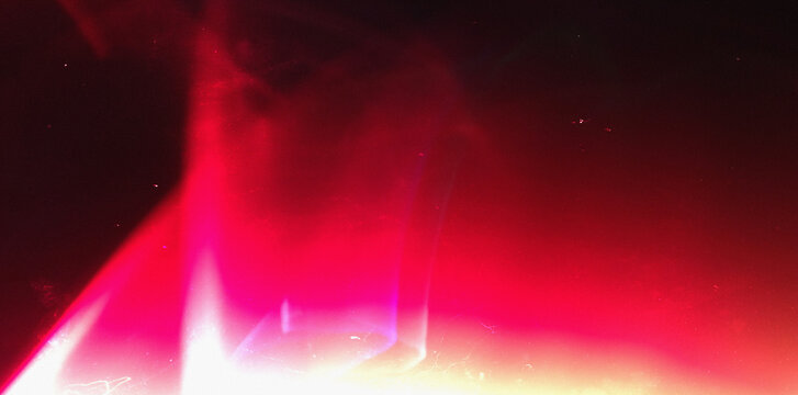 Dark cinematic red light beam abstract background.Retro film burn overlay.tones.Retro analog texture with overexposed light.