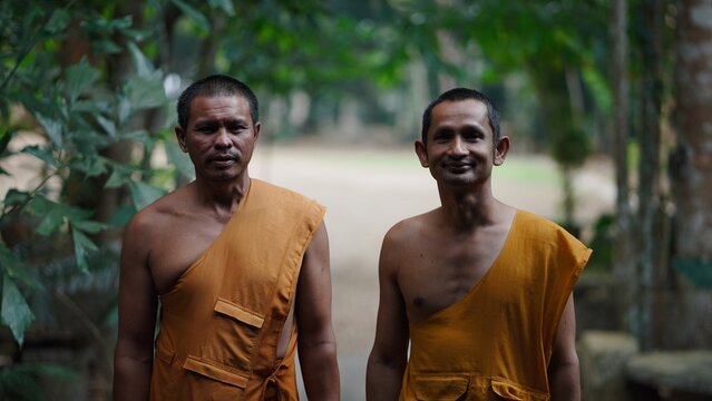 Two buddhist monks standing in khao phang monastery
