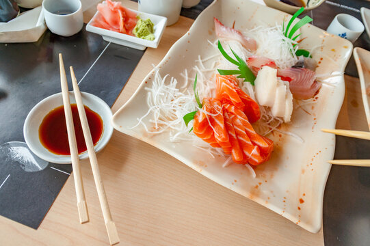 Salmon Sushi and Soy Sauce on Restaurant Table