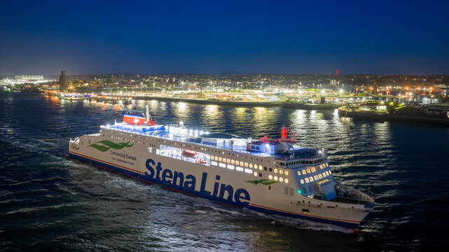 Stena Line ferry leaving Liverpool at night on the River Mersey with illuminated waterfront and maritime skyline.