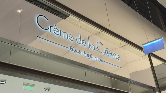 Vilnius Lithuania 09.05.2026 Creme de la Creme Haute Parfumerie illuminated luxury perfume boutique sign on modern shopping mall facade with elegant beauty branding and premium retail atmosphere