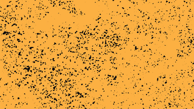 Orange background with small black spots and splatters texture pattern