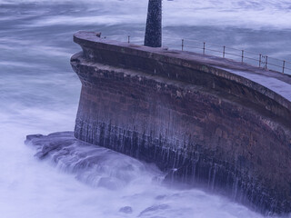 Seawall protecting coast from powerful ocean waves © Paul