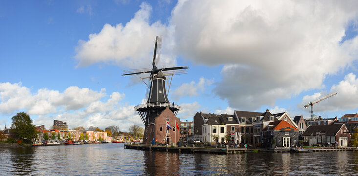 The Molen De Adriaan windmill in Haarlem is a cultural icon on the banks of the Spaarne River, rebuilt in 2002 and now functioning as a museum and tourist attraction.