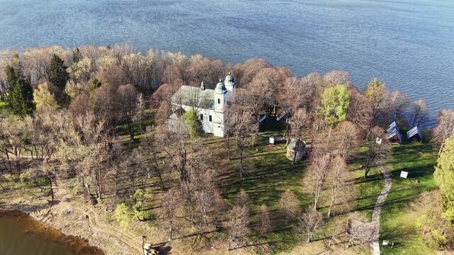Aerial footage of the historic Church of the Exaltation of the Holy Cross on Slanica Art Island, part of the Orava Gallery collection