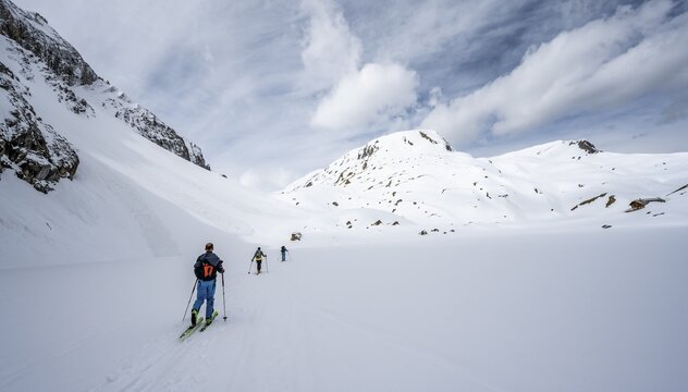 Ski tourers ascending from the Iffigtal to the Wildhornh&uuml;tte, snow-covered mountain landscape, Bernese Alps, Bernese Oberland, Switzerland