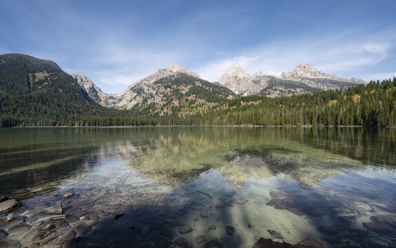Reflection in Taggart Lake, view of the Teton Range, peaks Grand Teton and Teewinot Mountain, autumn, Grand Teton National Park, Wyoming, USA