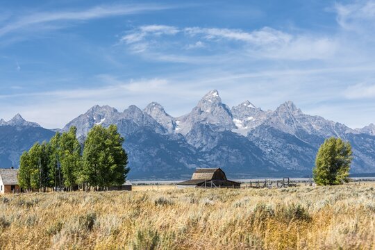 Historic old barn in front of the Teton Range mountain range, Mormon Row Historic District, Grand Teton National Park, Wyoming, USA