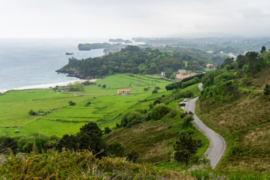 Toranda Beach coastline with green hills and calm waves
