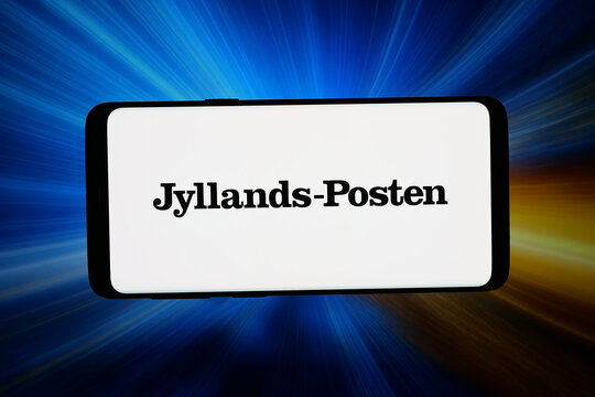 Stuttgart, Germany - 05-06-2026: In this photo illustration, the logo of Danish newspaper Jyllands-Posten is displayed on a smartphone in front of abstract background on computer screen.