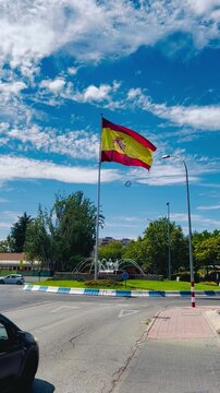 Spanish flag waving in the wind in Mostoles, Madrid, Spain