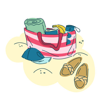 A striped beach bag sits on the sand next to flip-flops and a cap. Inside the bag is a rolled-up towel, a banana, a book, a water bottle, and a beach kit.