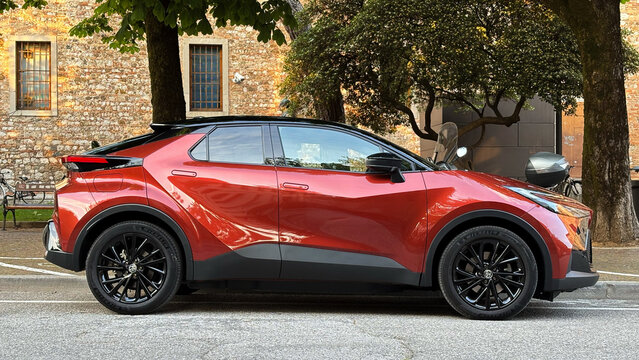 Second-generation Toyota C-HR, recognizable by its angular design and two-tone finish with black roof. Udine, Italy, May 9, 2026