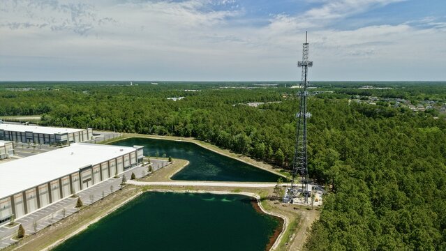 Aerial view of a tall telecommunications tower near the intersection of Saint Johns Parkway and International Golf Parkway in World Golf Village, Florida, United States.