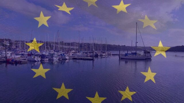 Overlay appearing sheer yellow star ring drifting over marina shifting across glints evoking flag