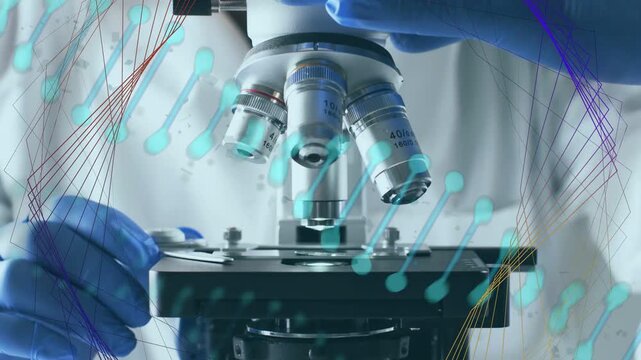 Lab tech holding slide turning turret lowering 40x focusing sample for analysis cyan nodes on hands