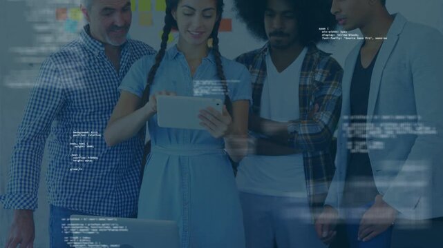 Team of four standing by glass table woman tapping tablet causing code overlay during tech review