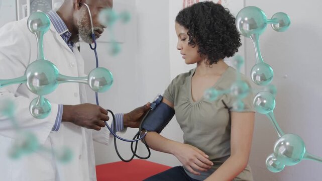 MD applying cuff as patient turning arm in clinic, checking BP with stethoscope, molecular overlay