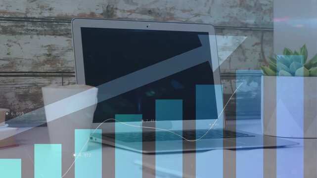 Data overlay appearing over silver laptop on desk, bars rising, trend line moving, showing growth