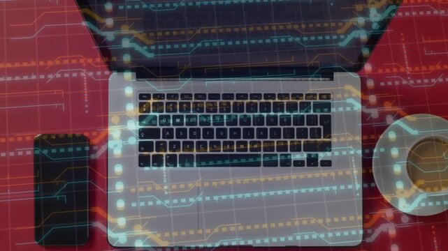 Animated digital overlay appearing over silver laptop, scrolling and pulsing to visualize data flow