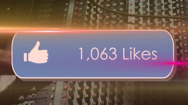 Warm light streak starting likes overlay updating to show likes on console as hand adjusting faders