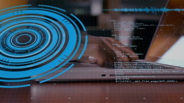 Developer typing on laptop keyboard, starting code scroll while blue HUD over left desk for editing