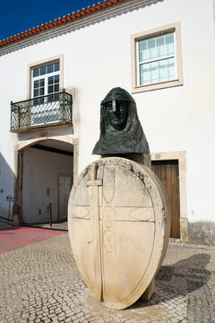 Templar soldier sculpture in a historic Portuguese town square