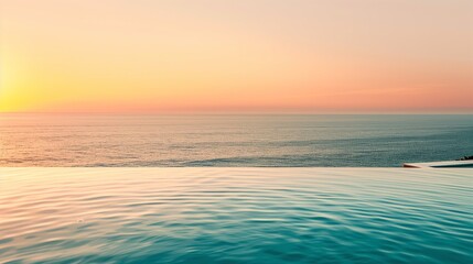 Plakat Luxury infinity pool overlooking ocean at sunset, golden light.