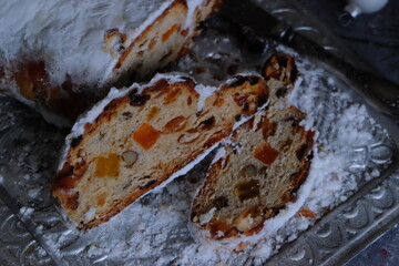 Fototapeta premium Traditional loaf with candied fruits and powdered sugar