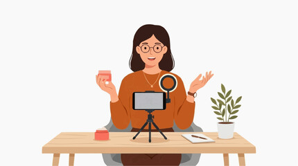 Fototapeta premium Woman recording video blog with product and plant on desk