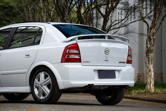 White Chevrolet Astra rear quarter close up, Classic hot hatch low angle view outdoors